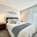 Carpeted bedrooms inside apartment homes at LYV Six Forks