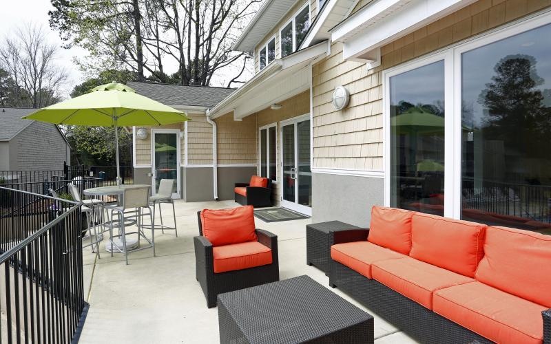 a patio with a table and chairs