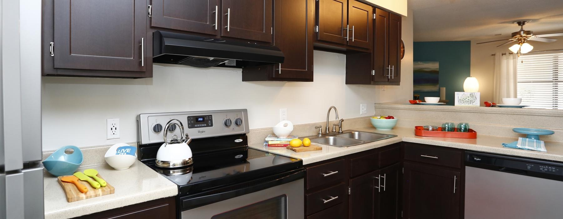 wide kitchen with open counter facing living room