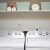 laundry closet with shelving and side-by-side washer/dryer units